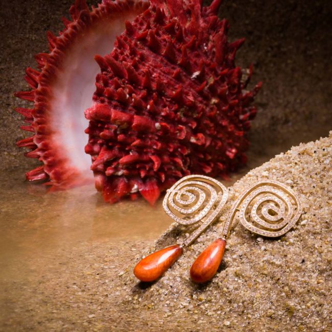 Spondylus oyster shell spiral pendant earrings set with micro-pavé diamonds.